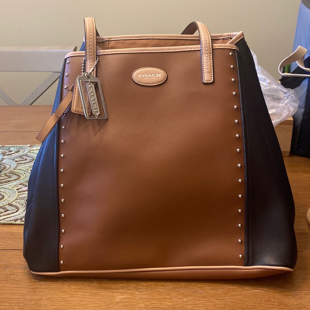 NWOT Coach leather handbag in tan and black.